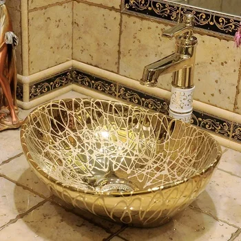 Европейский золотой настольный умывальник Позолоченный художественный межплатформенный бассейн Небольшой размер керамического умывальника в ванной комнате Овальный умывальник